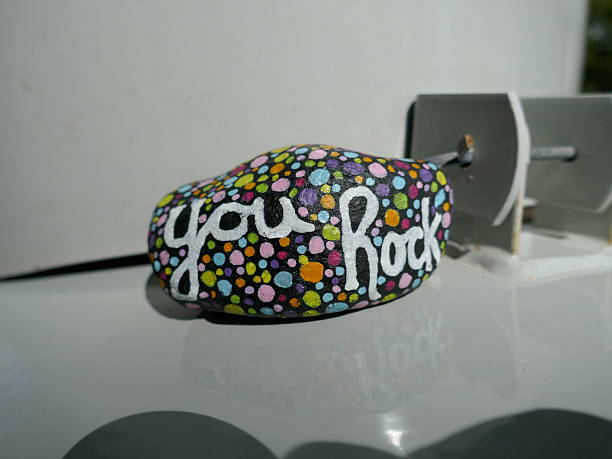 Kindness rock with you rock message on metal utility