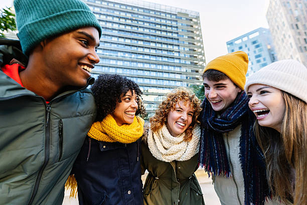 istock Young diverse friends having fun outdoors during a cold winter day 2234916271