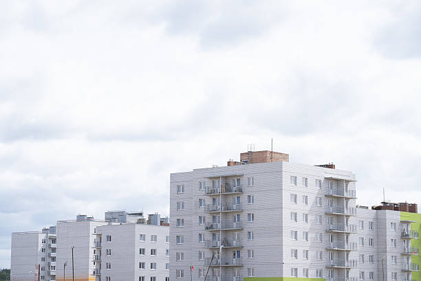 The ongoing development of modern buildings at the construction site is a vital task in progress. A construction site showcasing the ongoing development of modern residential buildings and facilities.