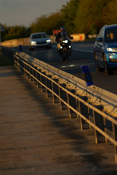 istock A man riding a motorcycle is traveling down a highway on a clear day 2234922410
