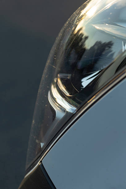 istock Closeup view of a car headlights reflection, showcasing its design 2234926175