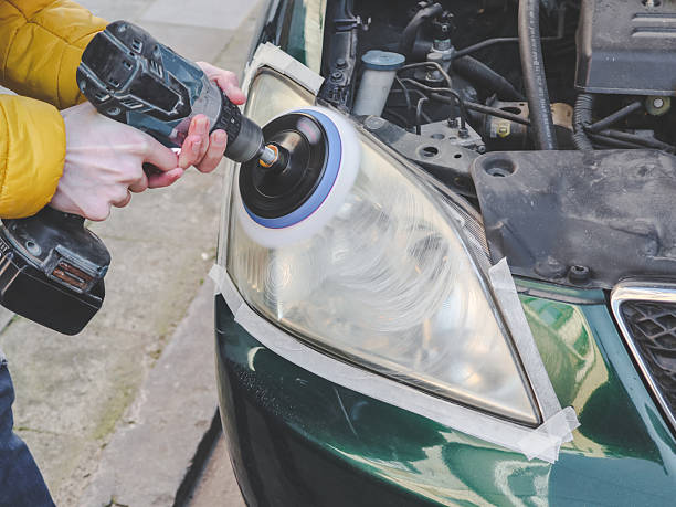 istock Hands of a man polishing a car headlight 2234926221