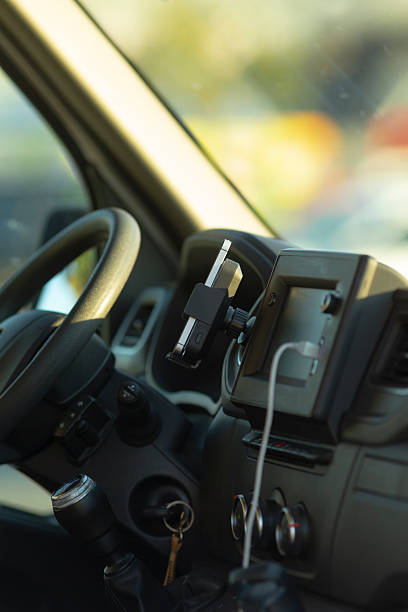 istock Car Interior Featuring Steering Wheel Alongside Phone Holder Accessory 2234926644