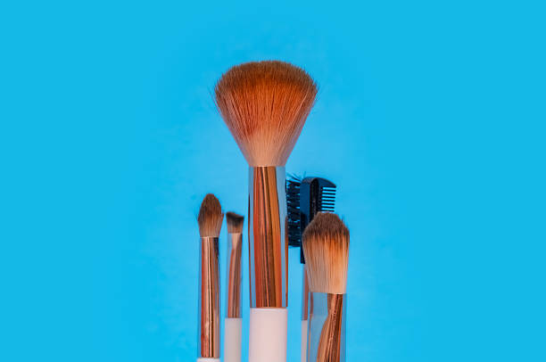 istock Set of make-up brushes arranged against a bright blue background. 2234927368