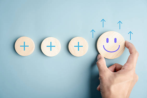 istock Mindset growth and personal development concept. Wooden blocks with plus a happy face, positive thinking and mental health improvement. 2234934547