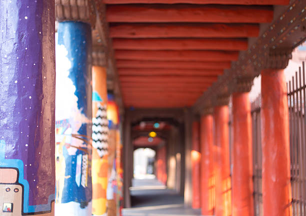 Santa Fe, NM - August 15, 2025: The vibrant arcade in front of the IAIA Museum of Contemporary Native Arts in downtown Santa Fe, with painted pillars.