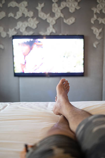 istock man leg relaxing on hotel bed 2234936295