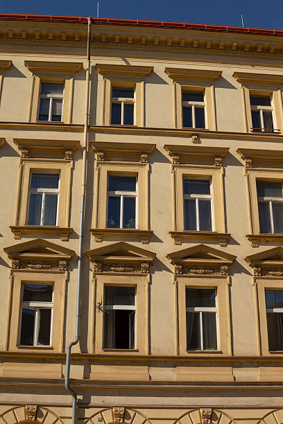 istock A substantial large building featuring numerous windows and a red roof 2234939962