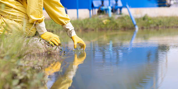 istock Close up Water quality control staff and sciene wearing PPE working sample water and analyze the quality, Industrial and environment 2234943294