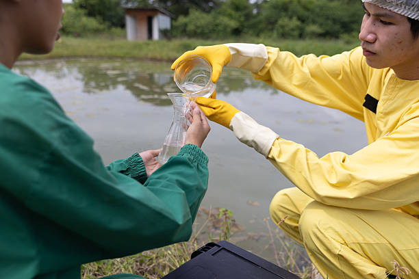 istock Close up Water quality control staff and sciene wearing PPE working sample water and analyze the quality, Industrial and environment 2234943356