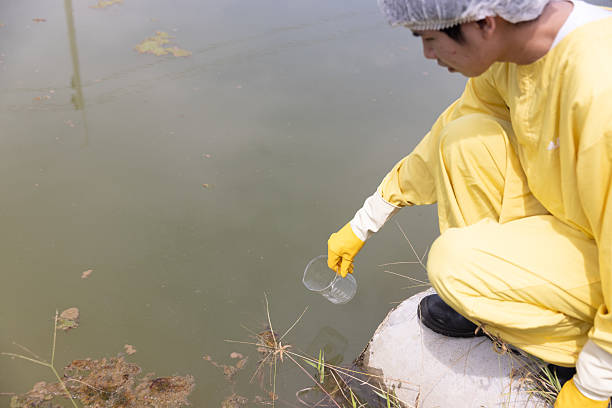 istock Close up Water quality control staff and sciene wearing PPE working sample water and analyze the quality, Industrial and environment 2234943362
