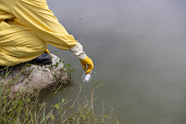 istock Close up Water quality control staff and sciene wearing PPE working sample water and analyze the quality, Industrial and environment 2234943377