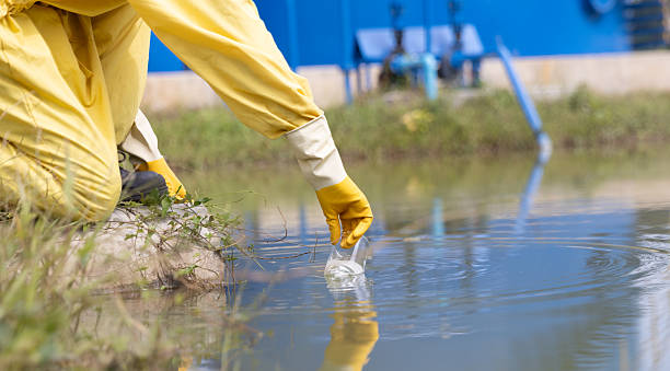 istock Close up Water quality control staff and sciene wearing PPE working sample water and analyze the quality, Industrial and environment 2234943379