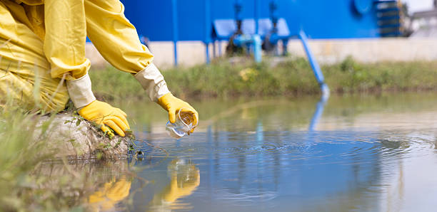 istock Close up Water quality control staff and sciene wearing PPE working sample water and analyze the quality, Industrial and environment 2234943393