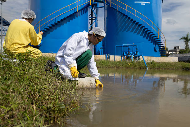 istock Water quality test, Environmental engineers wearing PPE sample inspect water quality , Industrial and environment 2234943914