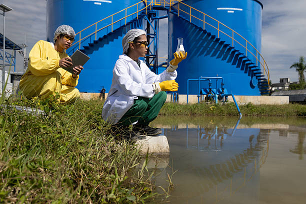 istock Water quality test, Environmental engineers wearing PPE sample inspect water quality , Industrial and environment 2234943918