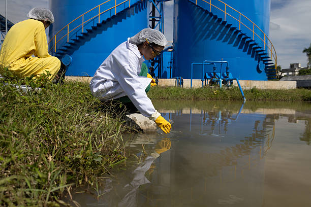 istock Water quality test, Environmental engineers wearing PPE sample inspect water quality , Industrial and environment 2234943919