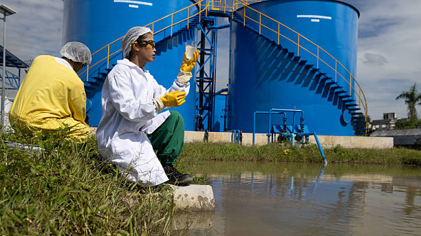 istock Water quality test, Environmental engineers wearing PPE sample inspect water quality , Industrial and environment 2234943926