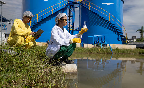 istock Water quality test, Environmental engineers wearing PPE sample inspect water quality , Industrial and environment 2234943938