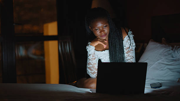 istock Focused Woman Engaging with Technology in Hotel Suite 2234948405