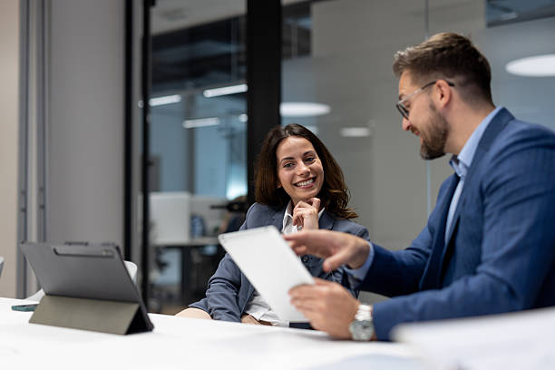 istock Business colleagues sharing ideas and working on digital tablet in office 2234948567