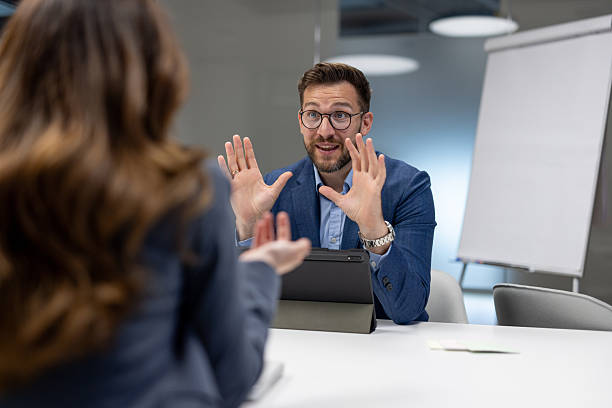 istock Businessman explaining something to his colleague during a meeting 2234948576