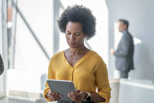 istock Focused black businesswoman using digital tablet in modern office 2234948787