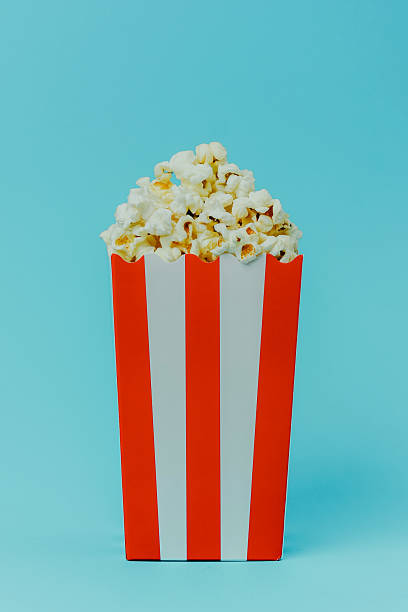 istock Enjoying a fresh popcorn snack in a vibrant setting for movie nights 2234948855