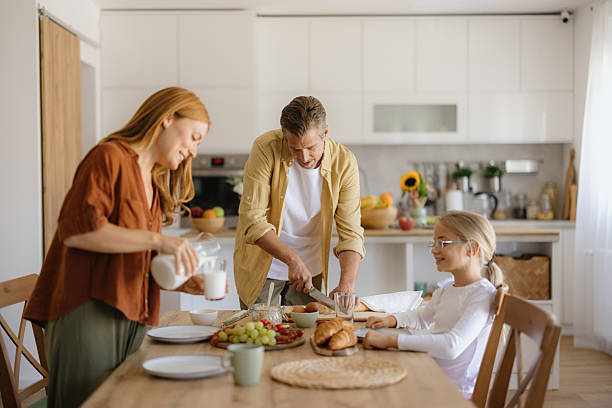 istock Family enjoying breakfast together in the kitchen 2234949420