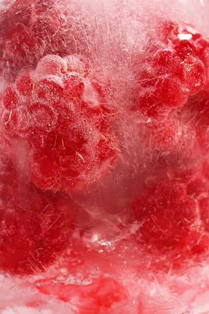istock Frozen Raspberry. Close up Vibrant and Refreshing Abstract Berries in Ice Crystal for Background. 2234950547