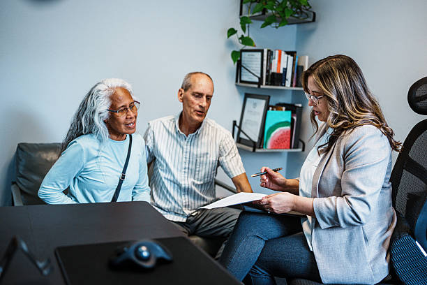 istock Latina financial advisor meeting with senior clients 2234952679