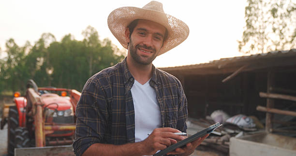 istock Men farm animals for a sustainable lifestyle. 2234953980