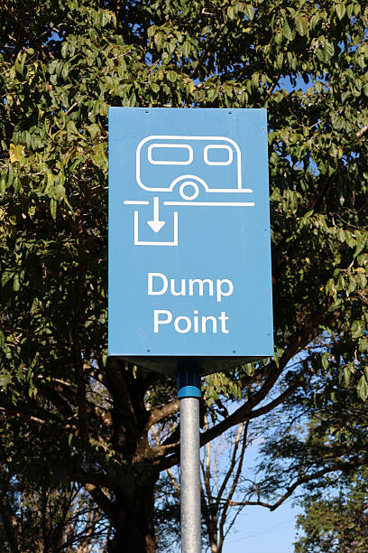 istock Blue Dump Point sign for RV caravans with a tree in the background 2234954678
