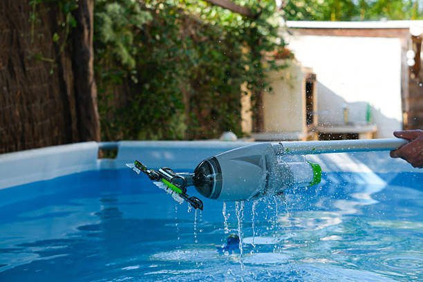 istock Pool Cleaning at Home. Handheld Cordless Rechargeable Pool Vacuum Cleaner. 2234956739