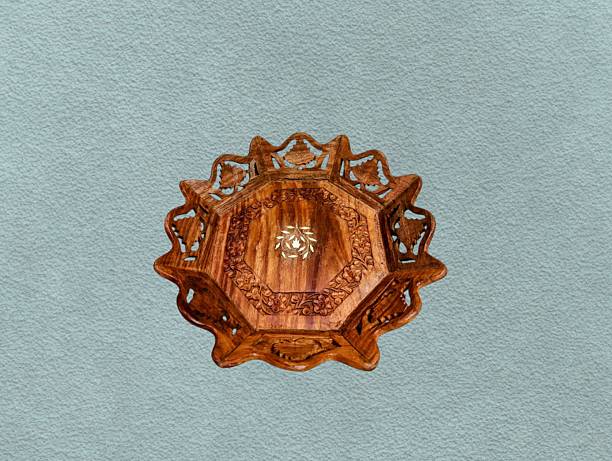 istock Wooden plate carved with floral patterns 2234957610