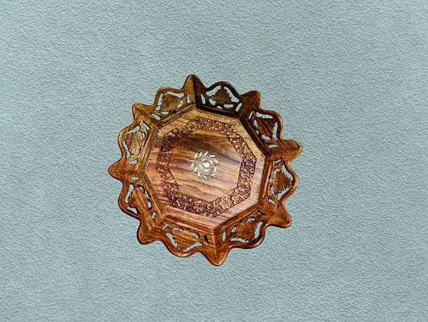 istock Wooden plate carved with floral patterns 2234957613