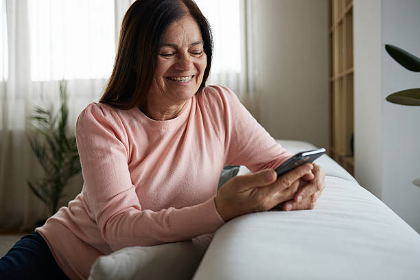 istock Senior woman using smart phone 2234958349
