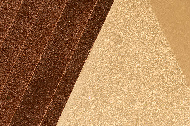 yellow beige and brown cement wall with sunlight background