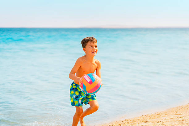 Photo from Hurghada in Egypt boy having fun on the beach. High quality photo