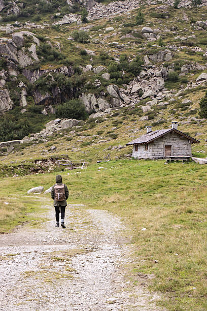 Madonna di Campiglio -  September 01, 2025: A young girl walking in a mountain hut in the Brenta Dolomites (Trentino, Italy)