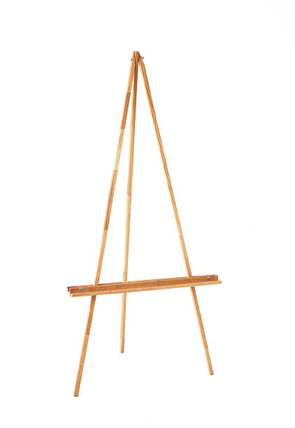 Empty wooden artist's easel, standing tall and ready, isolated on a bright white background. Perfect for themes of art, creativity, education, and display.