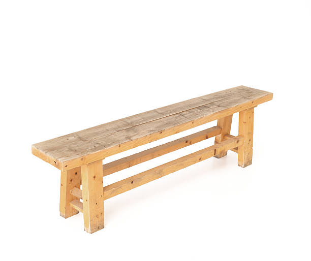 istock Simple, light-colored wooden bench on a white background, captured from an elevated angle. Perfect for themes of rustic charm, natural wood, and minimalist design. 2234962231