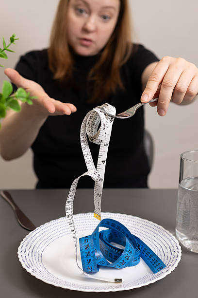 istock Measuring Expectations in a Plate During a Mindful Eating Discussion at a Dining Table 2234964748