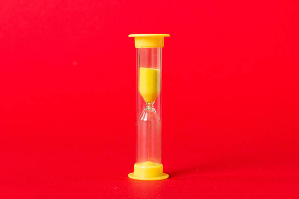 hourglass on the table, sand clock as time passing concept for business deadline, copy space.