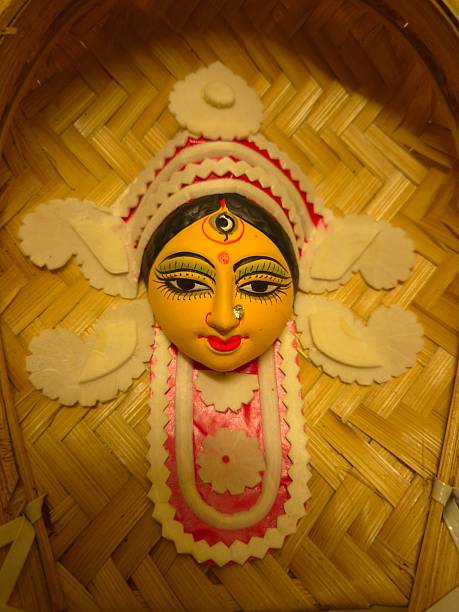 istock handcrafted wall hanging depicting the stylized face of Ma Durga, created for Durga Puja celebrations. 2234966409