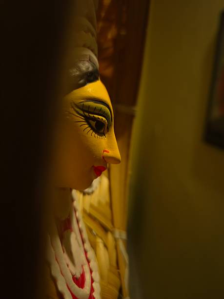 istock handcrafted wall hanging depicting the stylized face of Ma Durga, created for Durga Puja celebrations. 2234966932