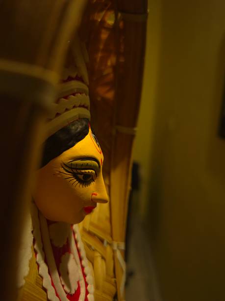istock handcrafted wall hanging depicting the stylized face of Ma Durga, created for Durga Puja celebrations. 2234966941