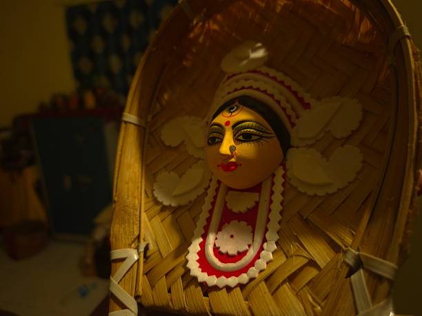 istock handcrafted wall hanging depicting the stylized face of Ma Durga, created for Durga Puja celebrations. 2234967534