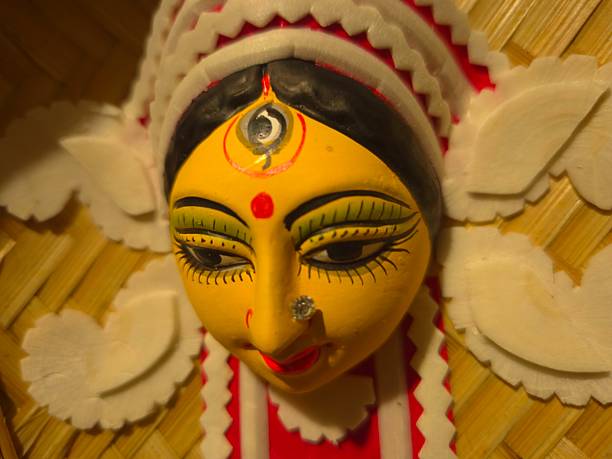 istock handcrafted wall hanging depicting the stylized face of Ma Durga, created for Durga Puja celebrations. 2234967892