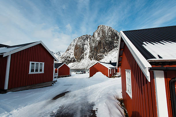 istock Red Cabins in Snowy Mountain Landscape 2234969740